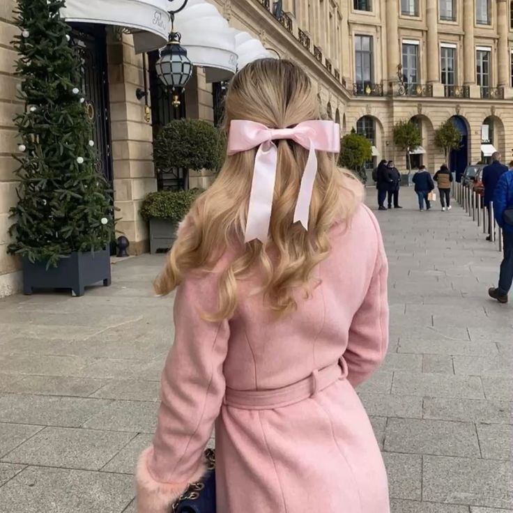 woman wearing pink coat