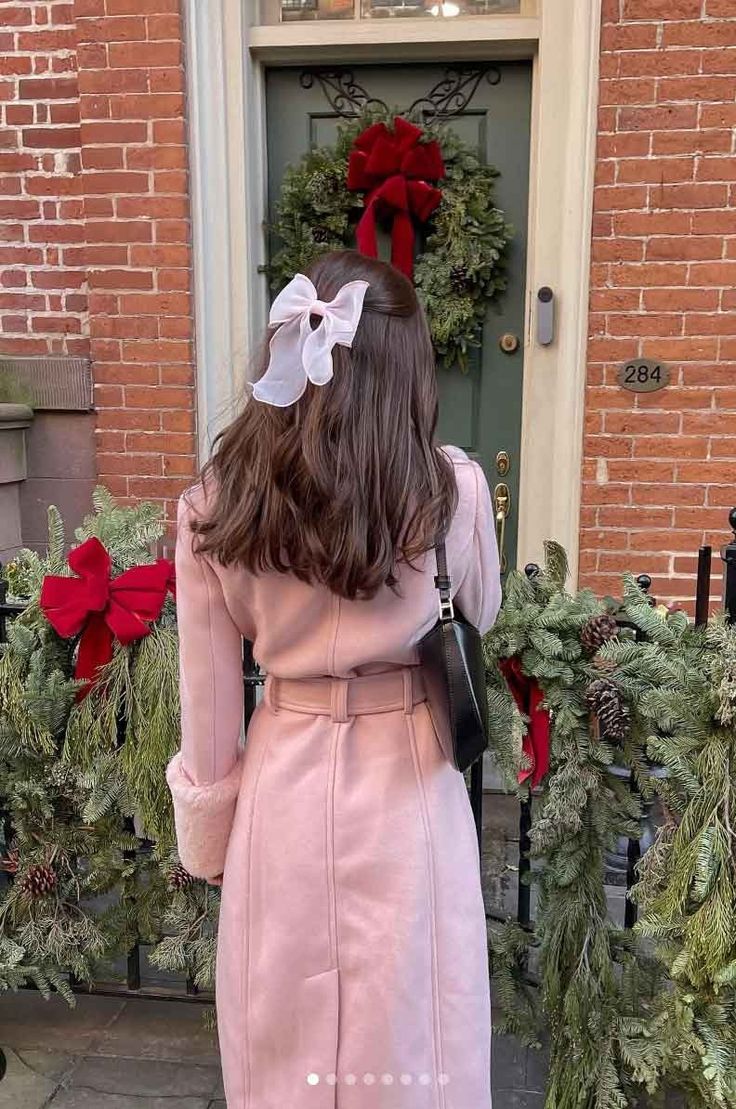 woman wearing pink coat